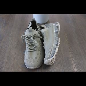 Cute,comfy brand new sneakers. Made out of stretchy material and clear sole.